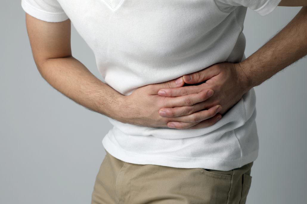 young man having a stomachache - Scott D. Miller, MD